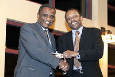 “Abdullahi Ahmed An-Na&#039;im (left) and Provost Earl Lewis.” Here, An-Na’im receives the 2006 Marion V. Creekmore Award for his internationalization of human rights at the Emory University Center for the Study of Law and Religion.